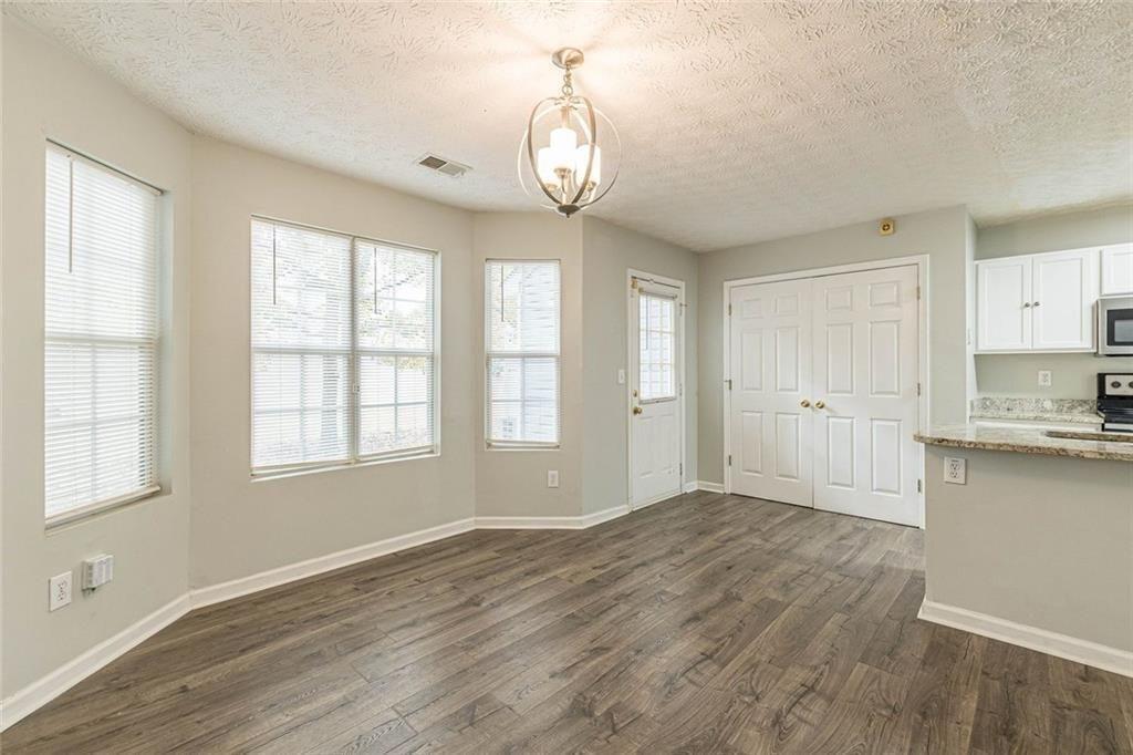 3151 Kingswood Glen Decatur, GA 30034 - Photo 9 of 38 a view of an empty room with window and wooden floor