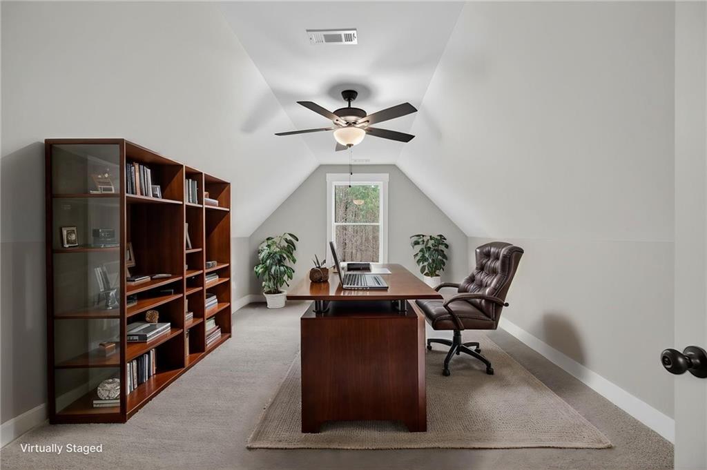 423 Relay Road Silver Creek, GA 30173 - Photo 11 of 48 a view of a workspace with furniture and a window