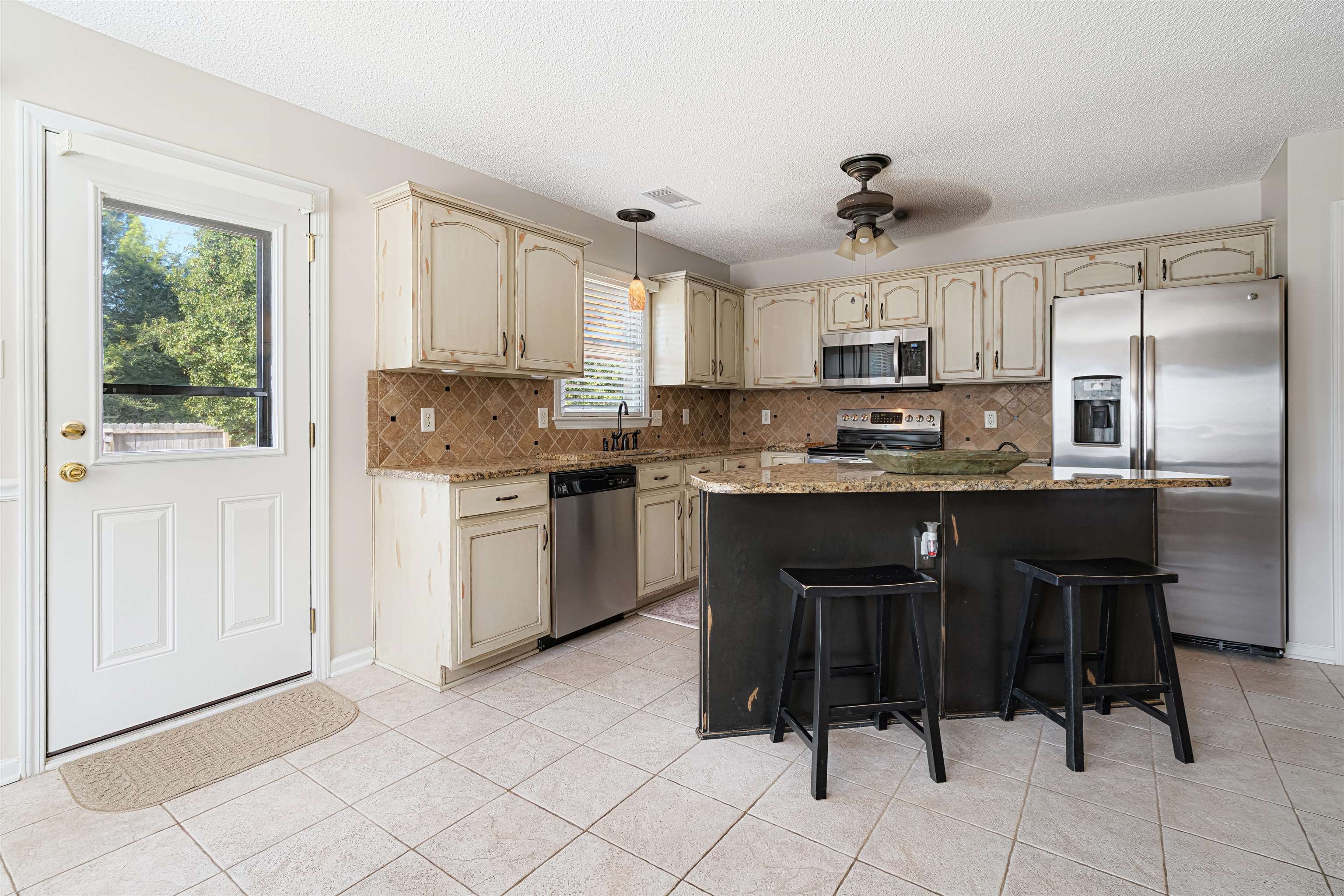 1337 Hunters Mill Trail Collierville, TN 38017 - Photo 11 of 25 a kitchen with a sink cabinets and window