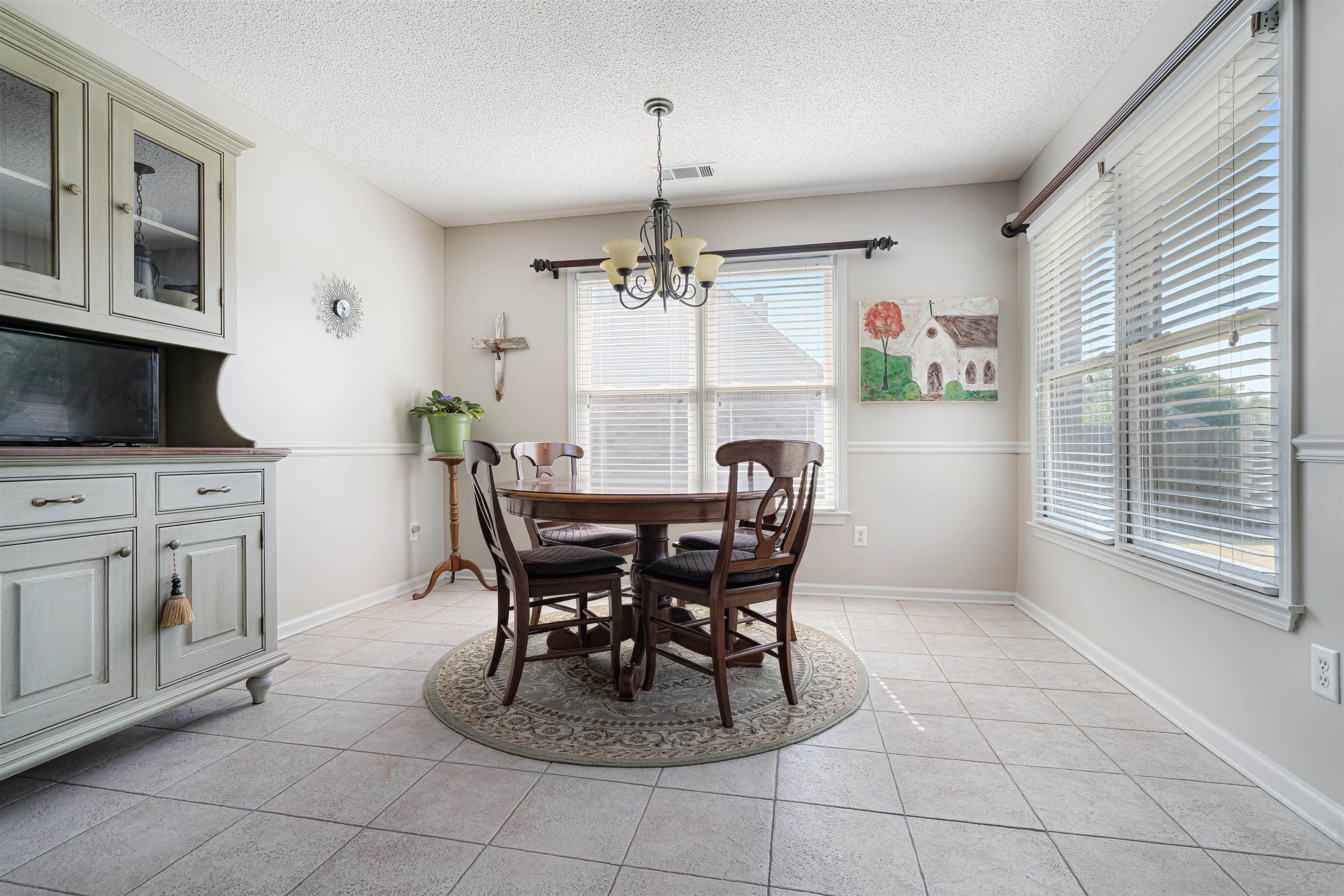 1337 Hunters Mill Trail Collierville, TN 38017 - Photo 12 of 25 a view of a dining room with furniture window and outside view