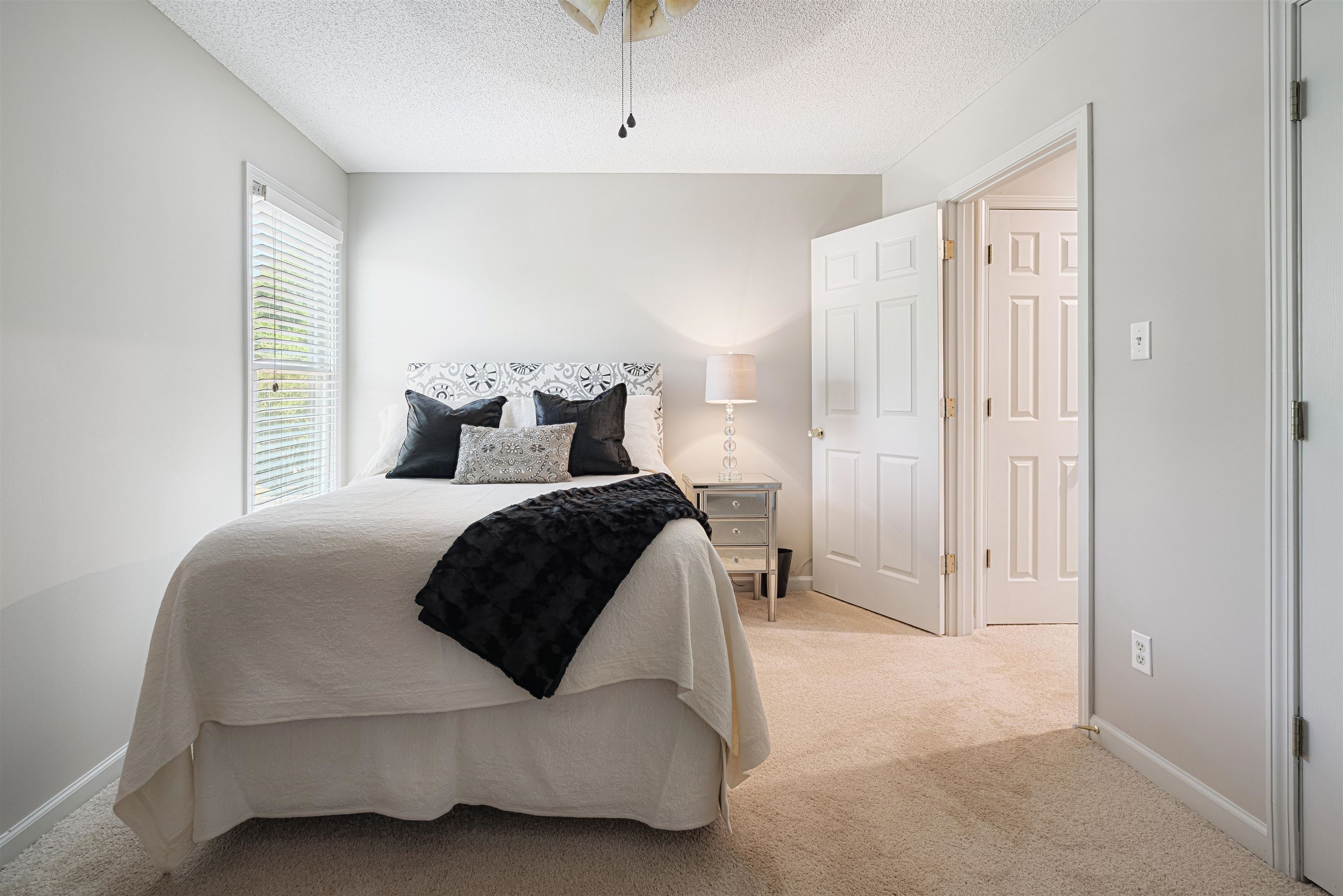 1337 Hunters Mill Trail Collierville, TN 38017 - Photo 17 of 25 a bedroom with a bed and a window