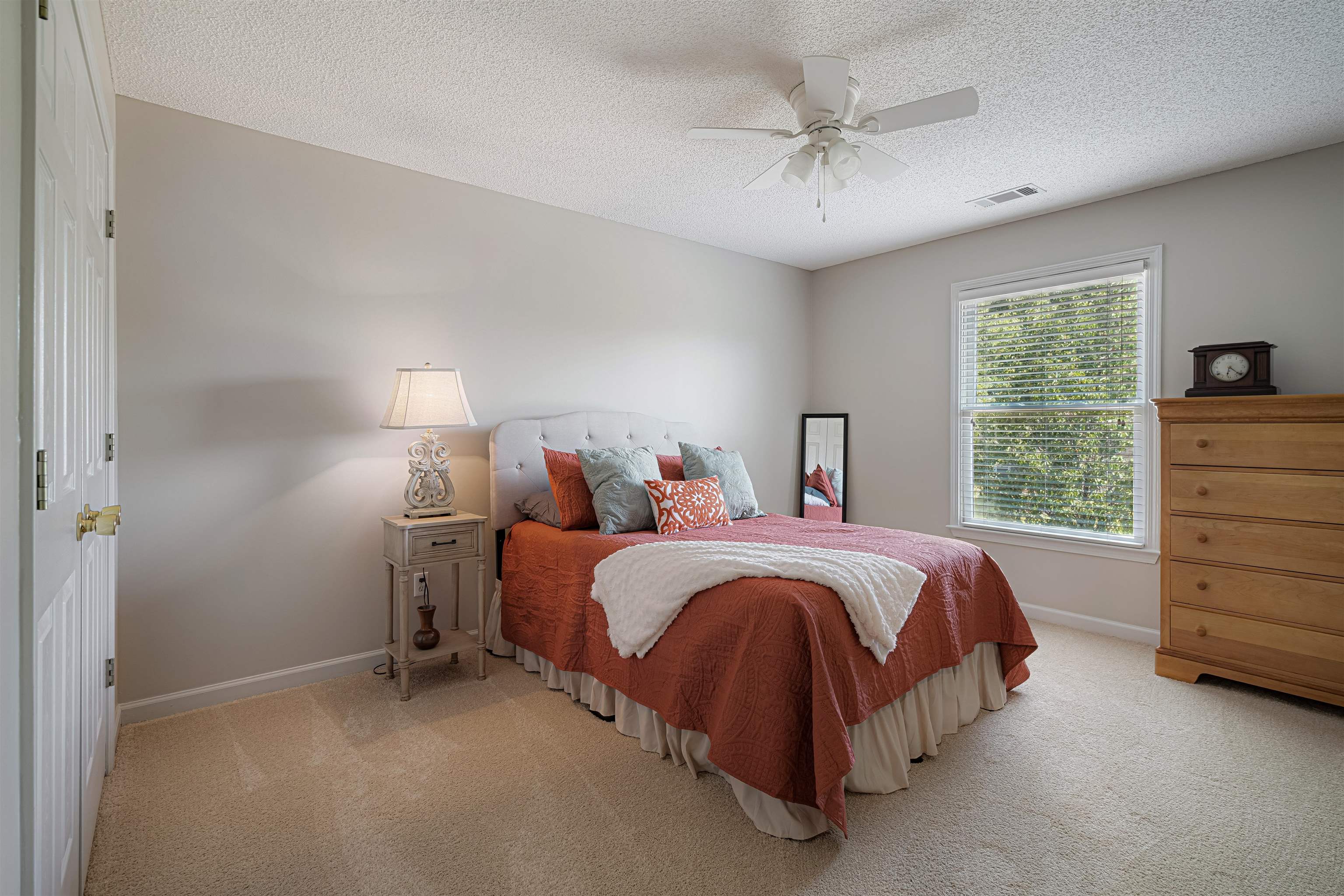 1337 Hunters Mill Trail Collierville, TN 38017 - Photo 18 of 25 a bed room with a bed and a ceiling fan