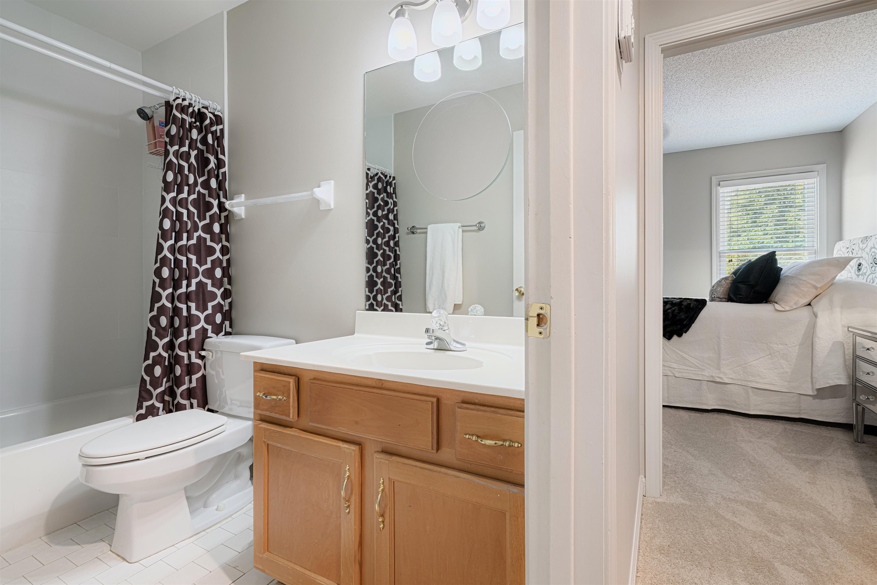 1337 Hunters Mill Trail Collierville, TN 38017 - Photo 20 of 25 a en suite bathroom with a sink a toilet and shower