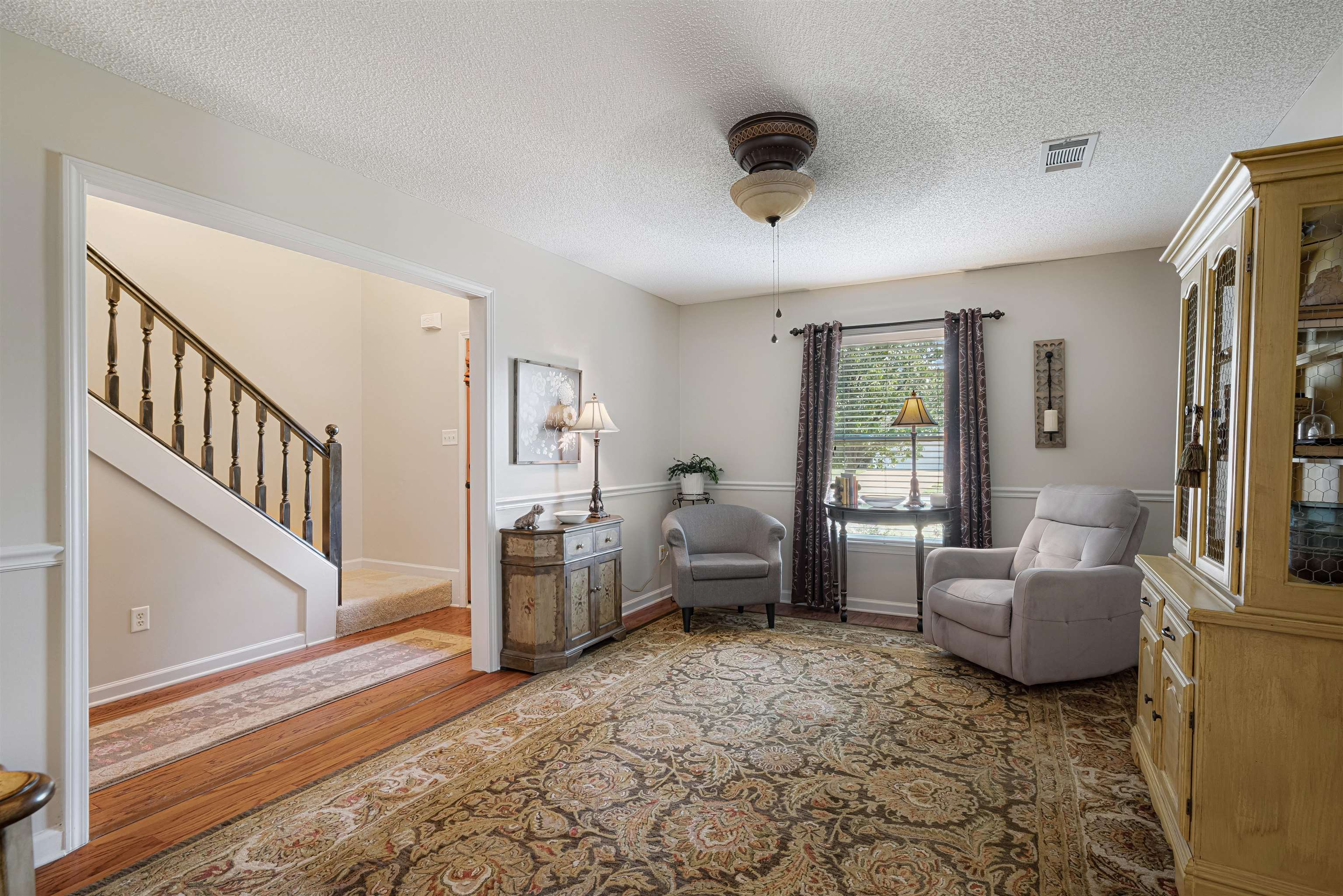 1337 Hunters Mill Trail Collierville, TN 38017 - Photo 5 of 25 a living room with furniture and a floor to ceiling window