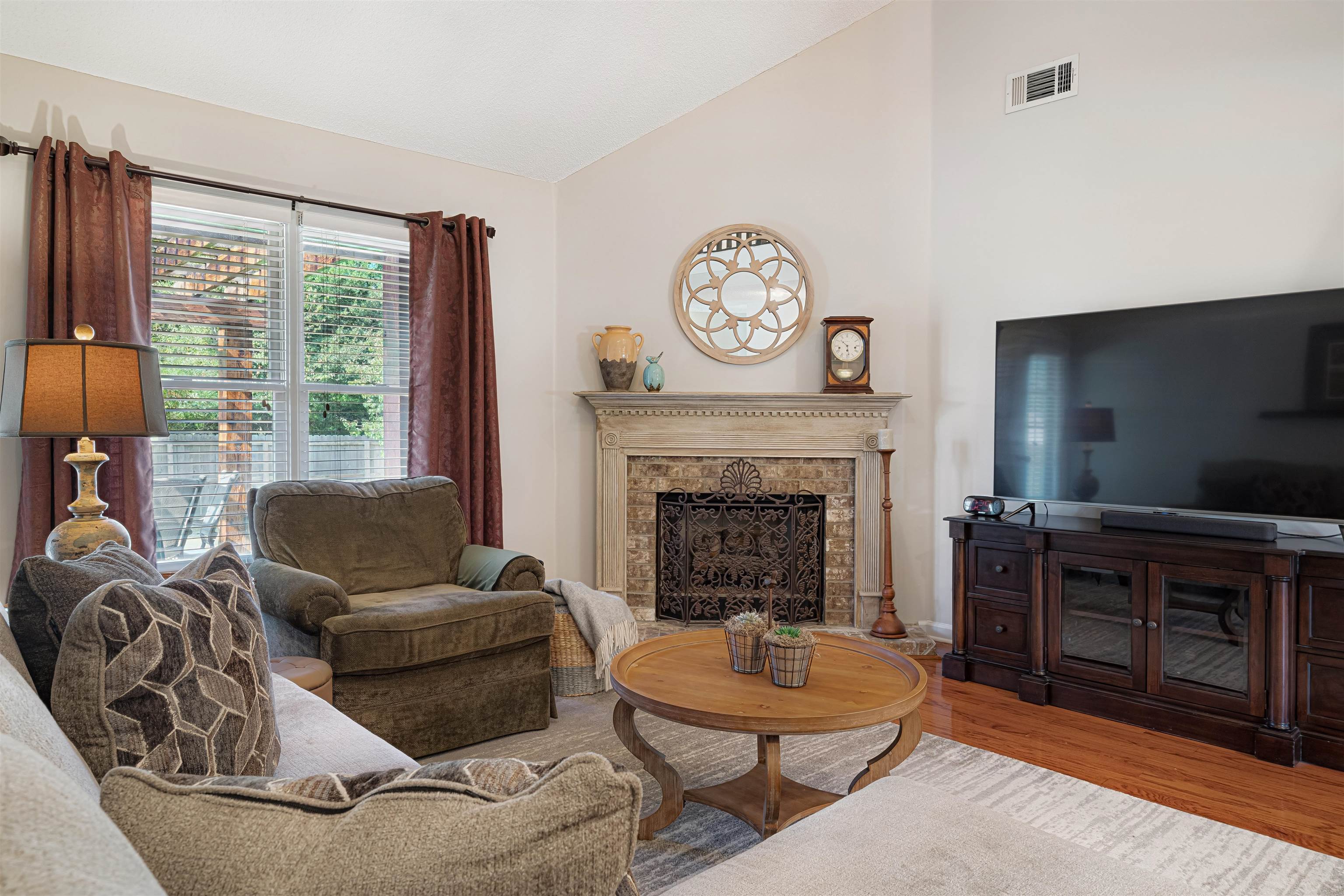 1337 Hunters Mill Trail Collierville, TN 38017 - Photo 7 of 25 a living room with furniture and a fireplace