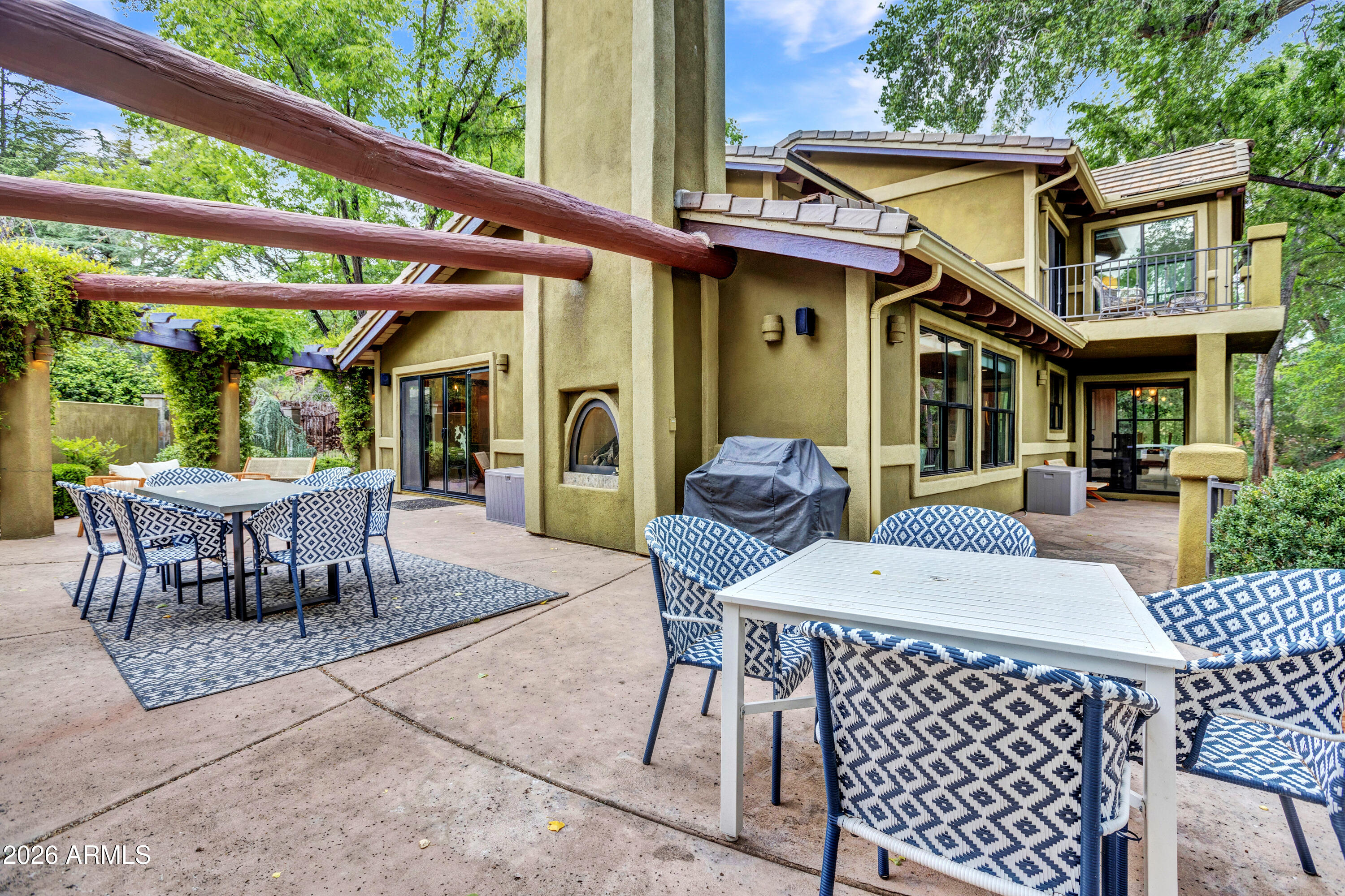 55 Ranch House Circle Sedona, AZ 86336 - Photo 54 of 61 a view of a patio with a table and chairs
