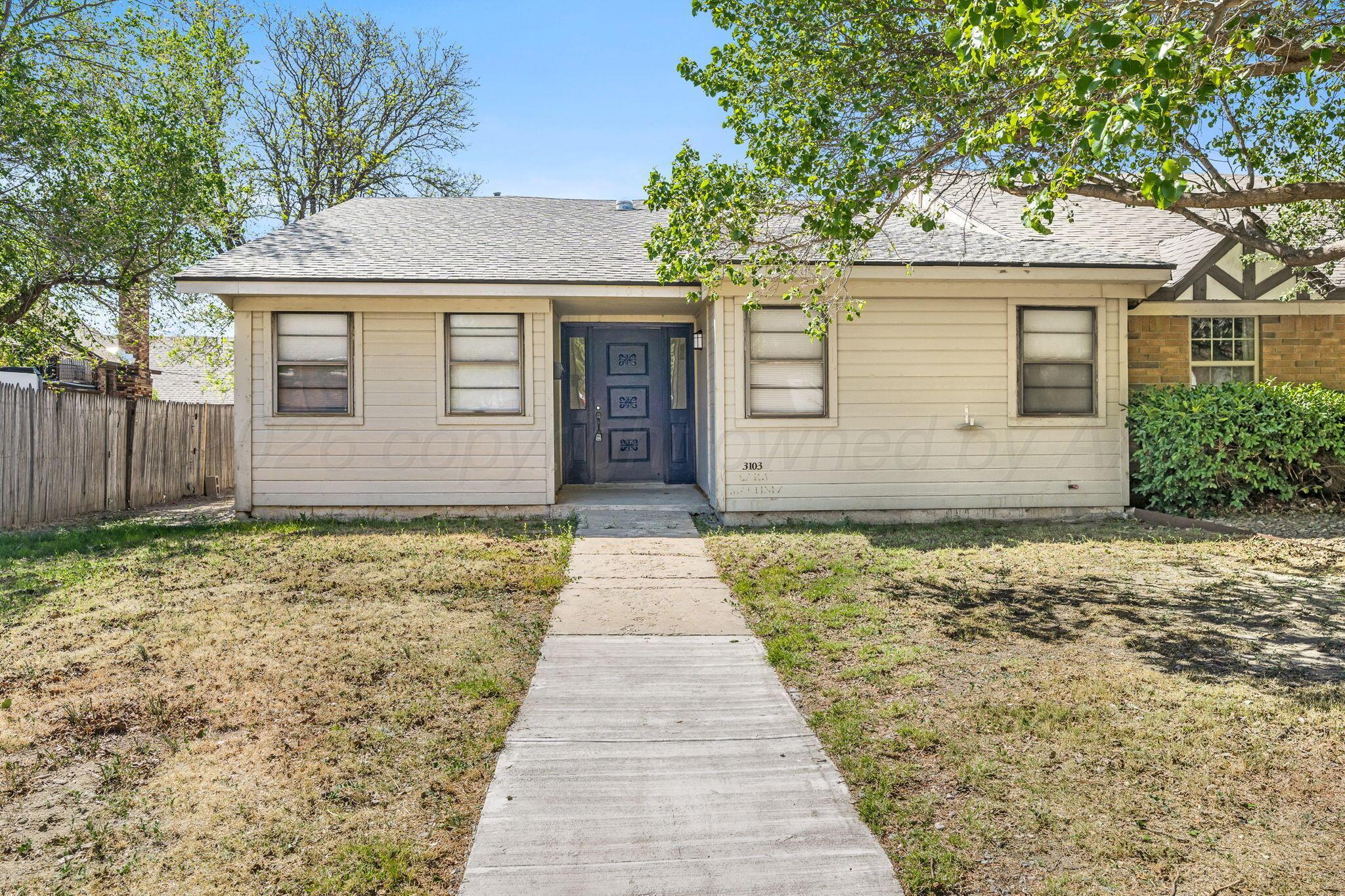 3103 Southwest 27th Avenue Amarillo, TX 79109 - Photo 2 of 21 a front view of a house with a garden