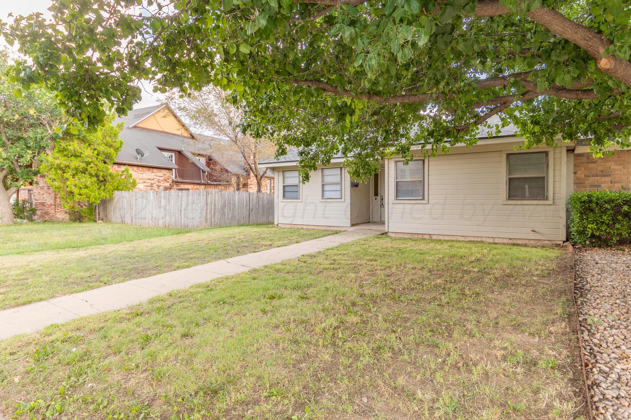 3103 Southwest 27th Avenue Amarillo, TX 79109 - Photo 3 of 21 front view of a house with a yard