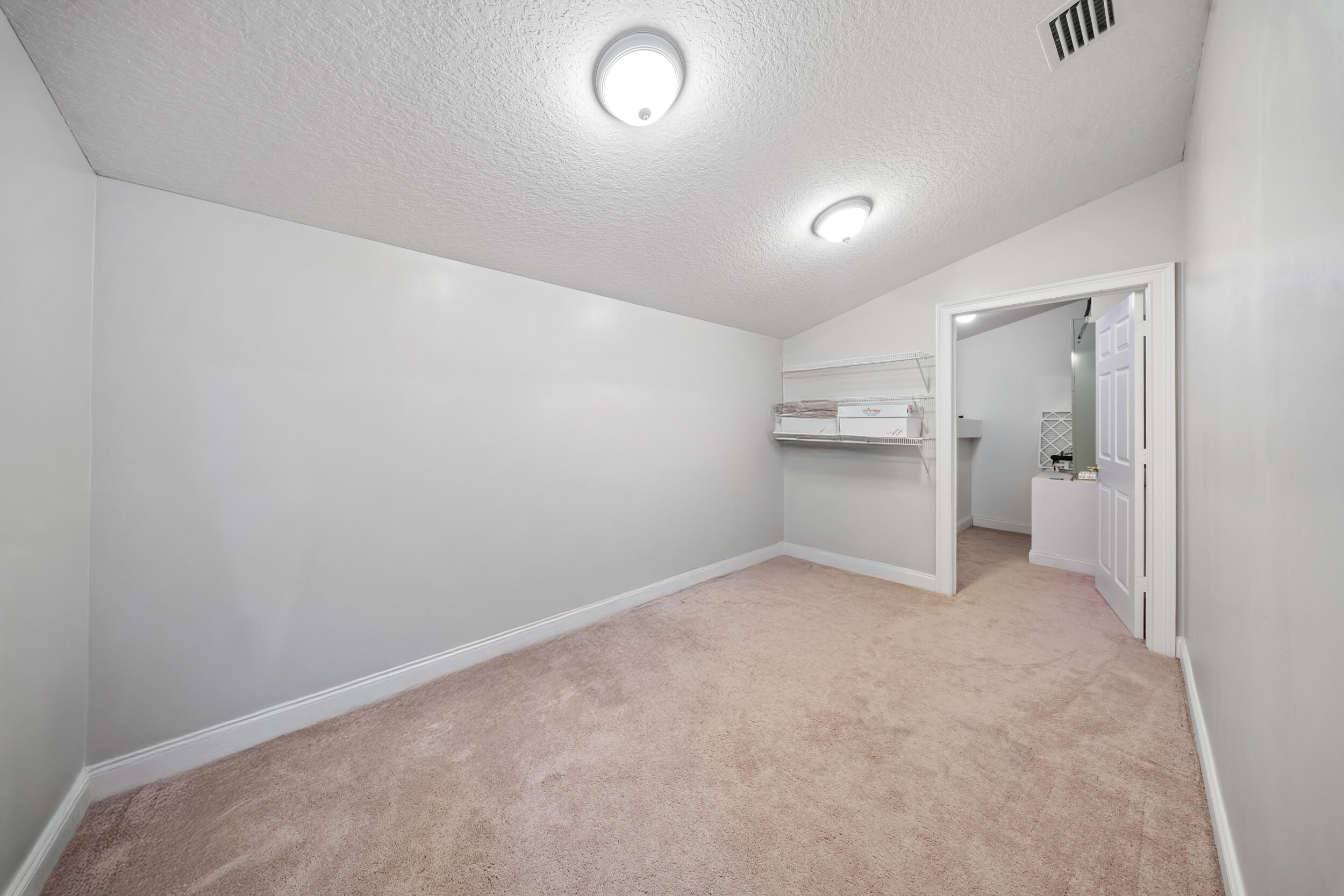 8686 Andrews Avenue Fort Pierce, FL 34945 - Photo 56 of 76 an empty room with a cabinet and a stove