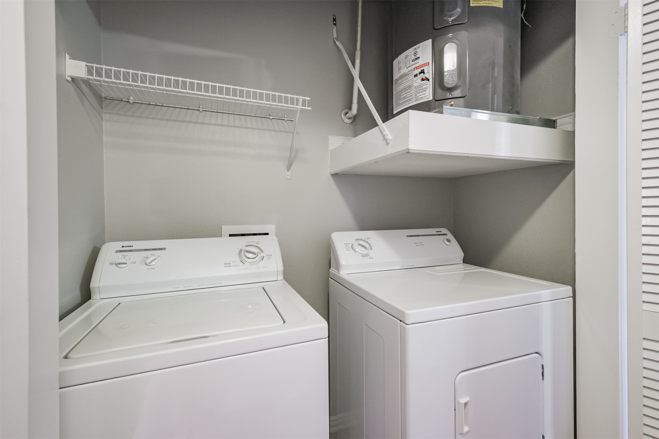 2111 Welch Street, Unit B304 Houston, TX 77019 - Photo 17 of 37 a utility room with dryer and washer
