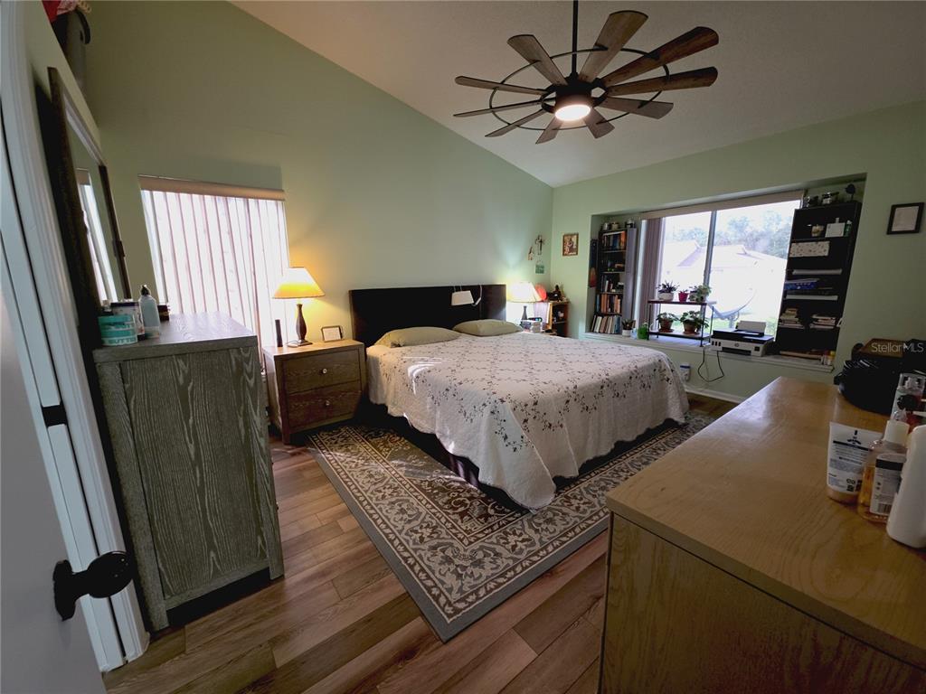 10085 Blackburn Street Spring Hill, FL 34608 - Photo 11 of 25 a bedroom with bed and window