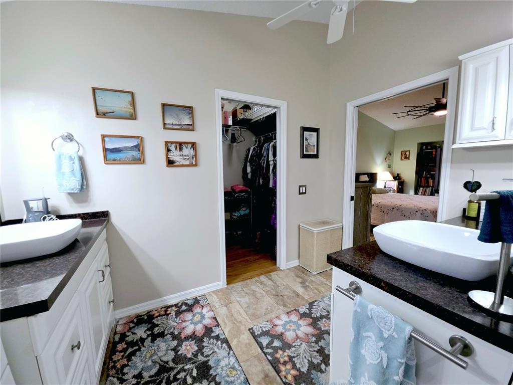10085 Blackburn Street Spring Hill, FL 34608 - Photo 13 of 25 a kitchen with a sink stove and cabinets