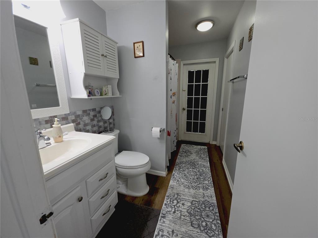 10085 Blackburn Street Spring Hill, FL 34608 - Photo 19 of 25 a bathroom with a sink toilet and shower