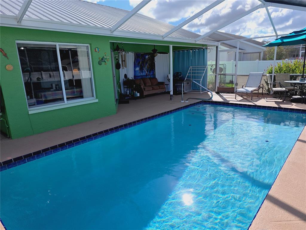 10085 Blackburn Street Spring Hill, FL 34608 - Photo 24 of 25 a view of a backyard with a patio and a garden
