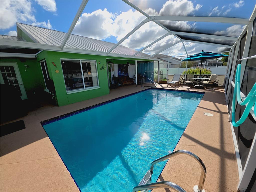 10085 Blackburn Street Spring Hill, FL 34608 - Photo 25 of 25 a view of swimming pool with outdoor seating