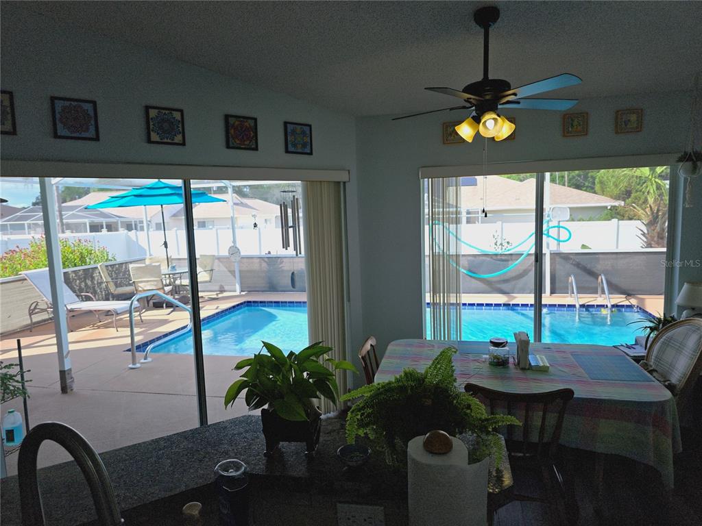 10085 Blackburn Street Spring Hill, FL 34608 - Photo 10 of 25 a view of a dining room with furniture window and outside view