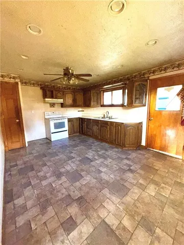 a view of a swimming pool with a lounge chair