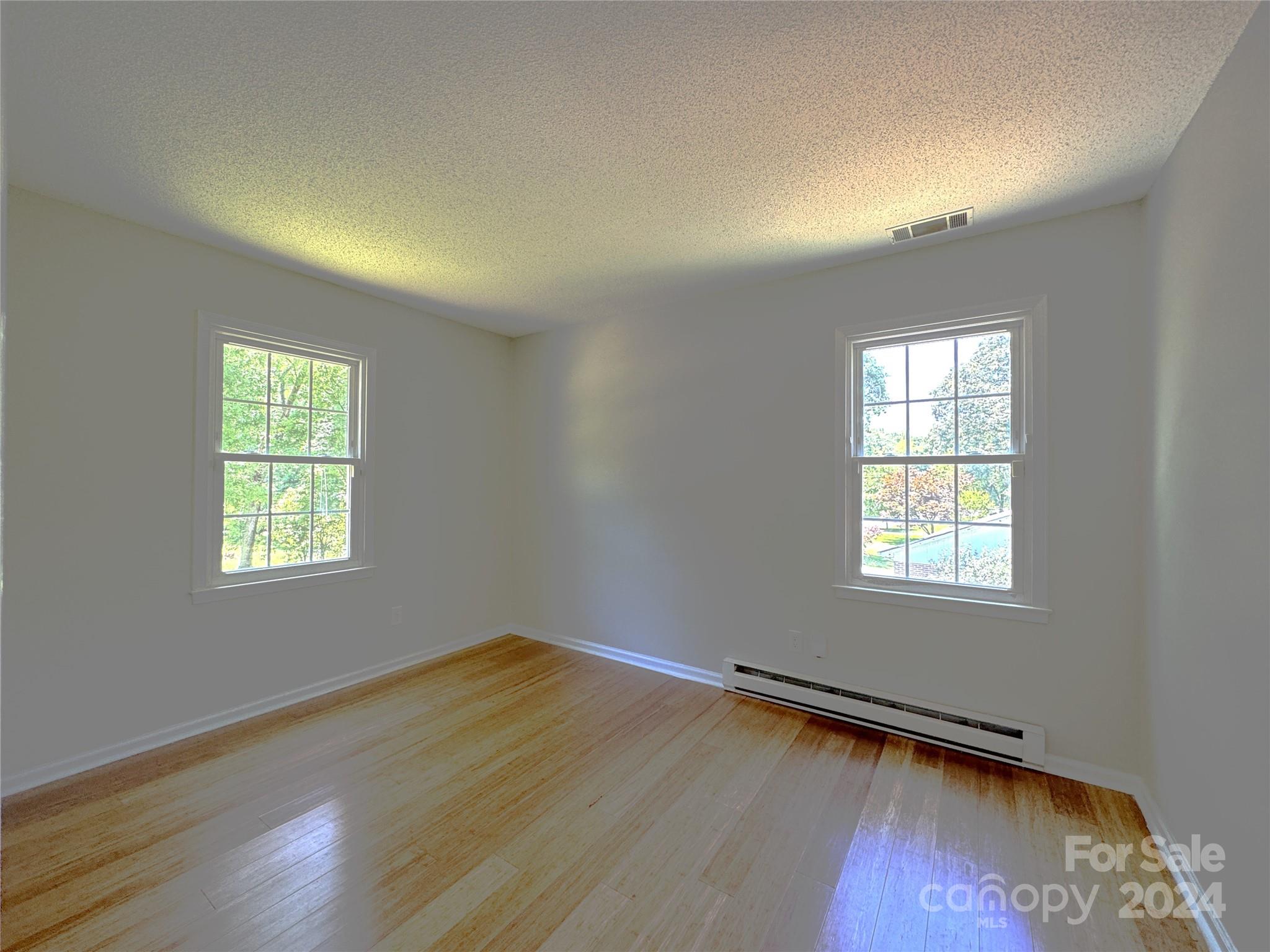 6131 Trotters Ridge Road Charlotte, NC 28227 - Photo 19 of 29 a view of a room with wooden floor and windows