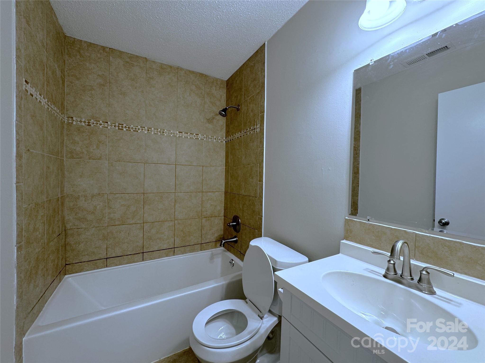6131 Trotters Ridge Road Charlotte, NC 28227 - Photo 20 of 29 a bathroom with a sink a toilet and a bathtub