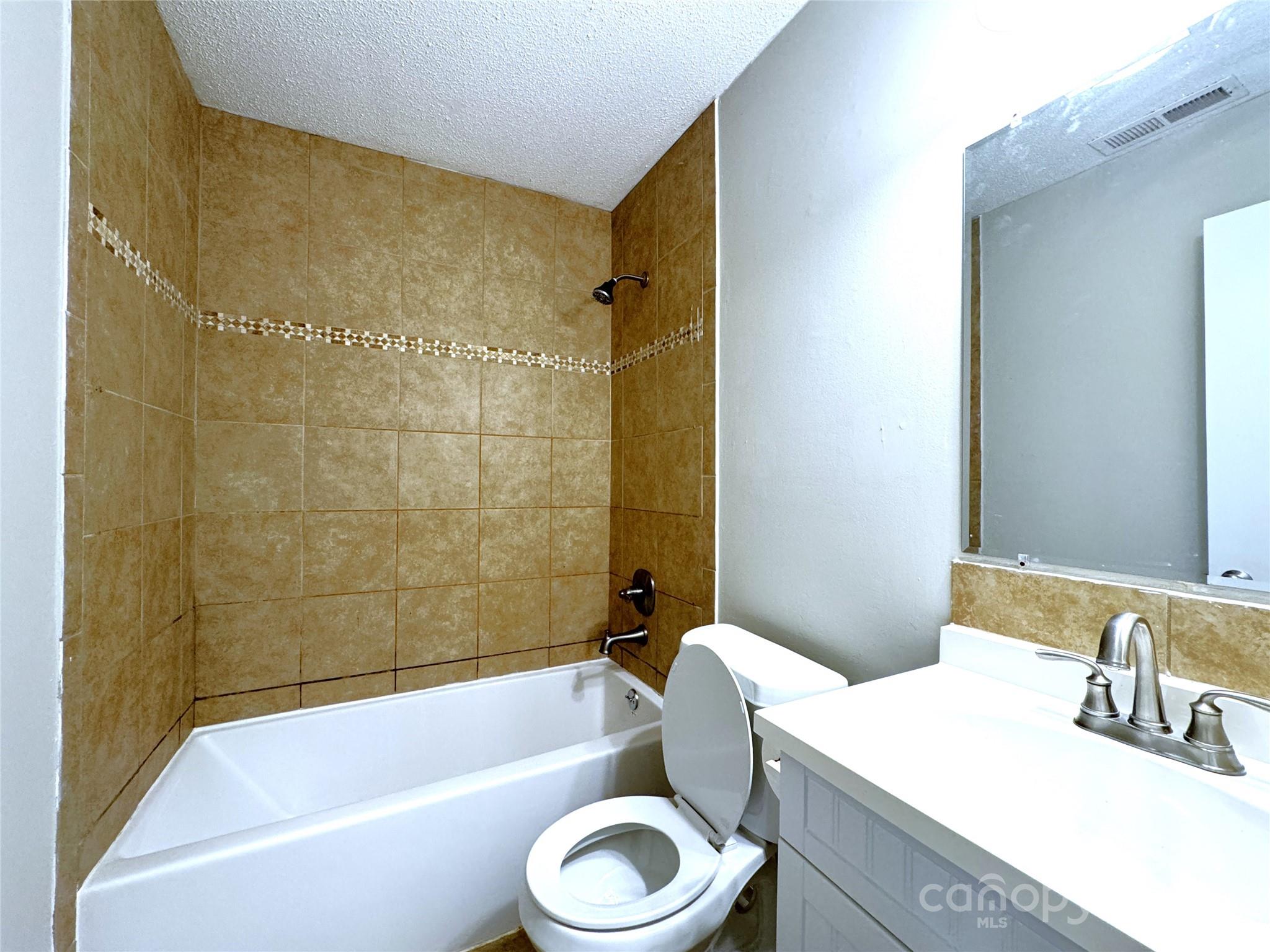6131 Trotters Ridge Road Charlotte, NC 28227 - Photo 21 of 29 a bathroom with a sink a toilet and a bathtub
