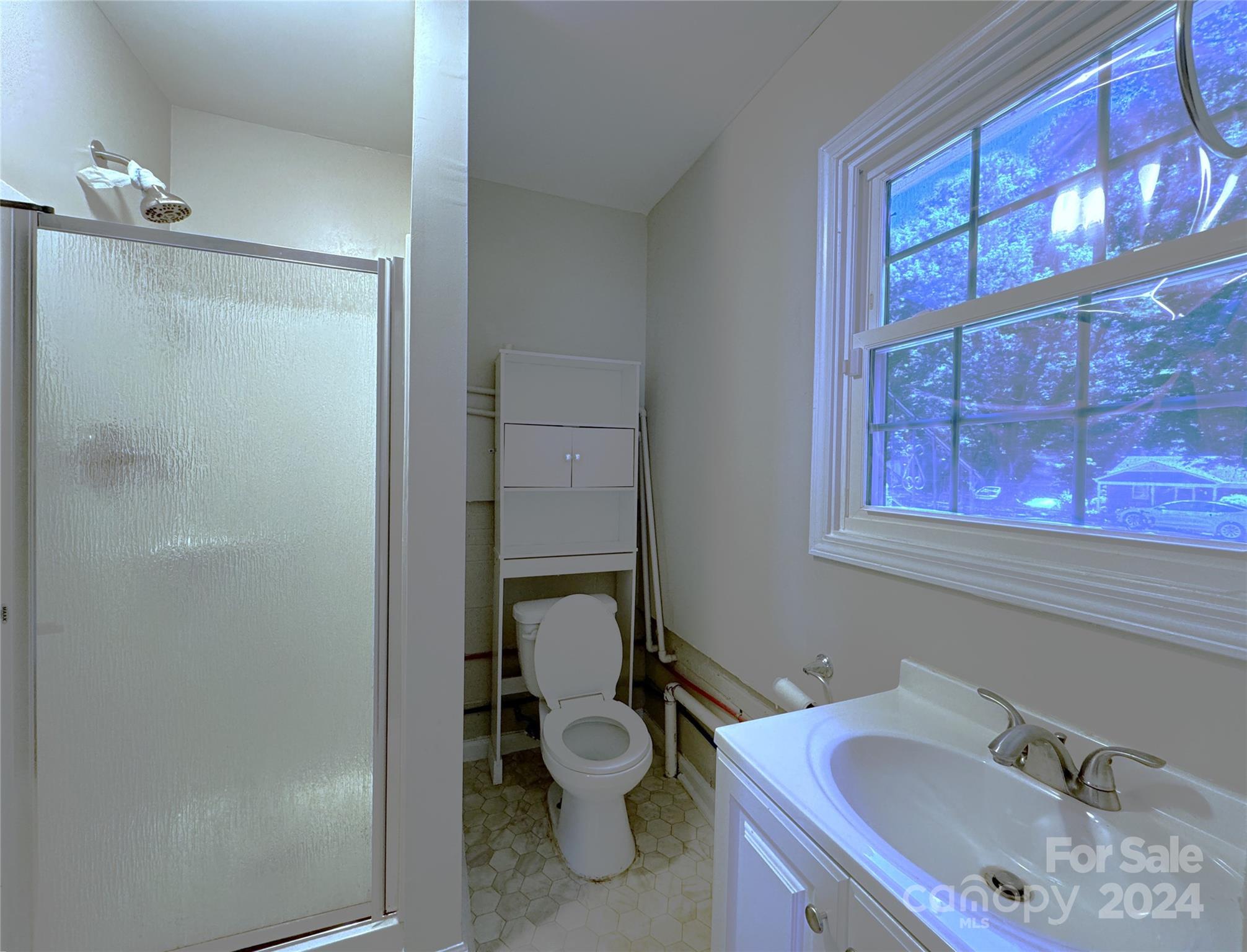6131 Trotters Ridge Road Charlotte, NC 28227 - Photo 25 of 29 a bathroom with a sink and a toilet