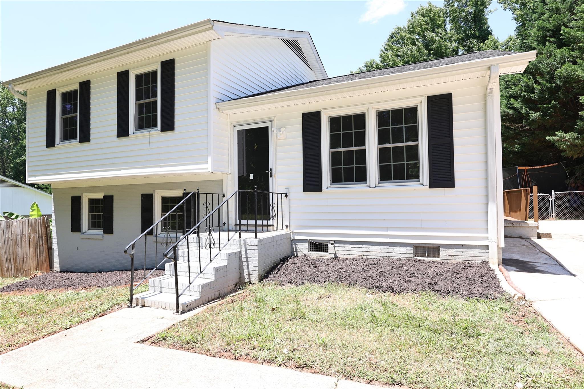 6131 Trotters Ridge Road Charlotte, NC 28227 - Photo 27 of 29 a front view of a house with a yard