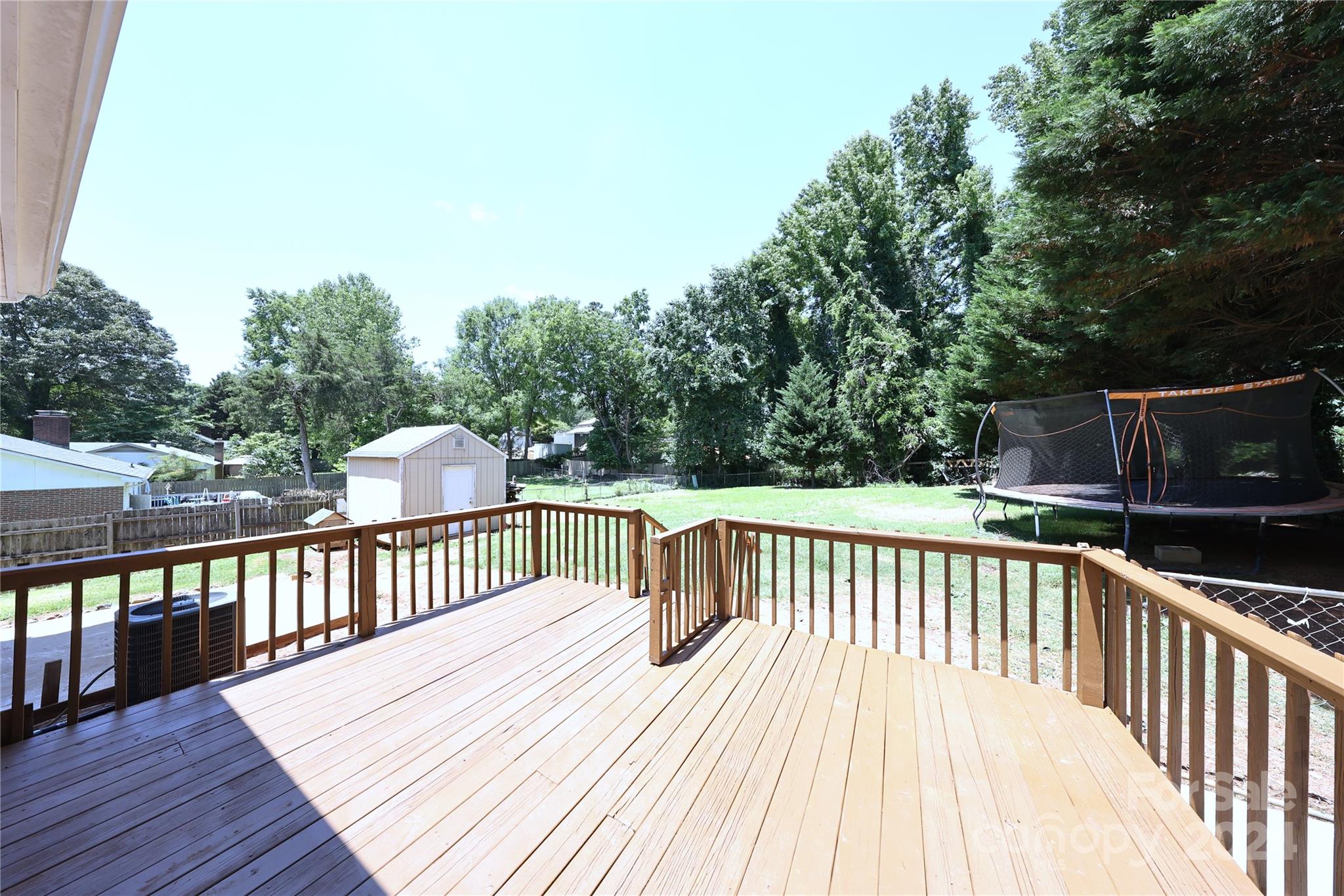 6131 Trotters Ridge Road Charlotte, NC 28227 - Photo 28 of 29 a view of deck with patio and wooden fence