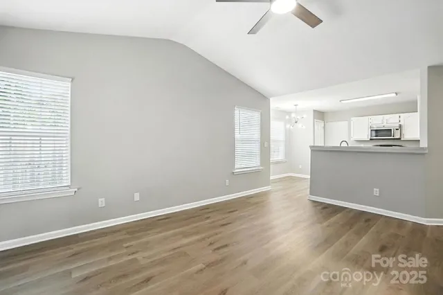 a living room with a fireplace and a rug