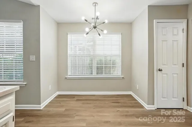 a view of a kitchen with an empty space and a window