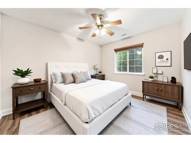 a bed room with a bed and a dresser