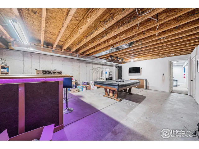 a room with furniture and pool table