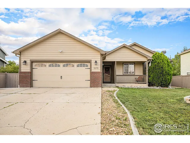 a view of front of house with a yard