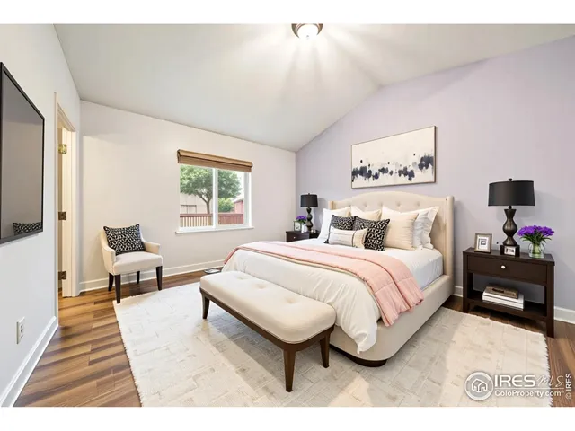 a bed room with a bed and a chair