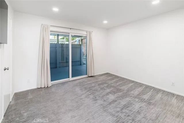 an empty room with sliding door