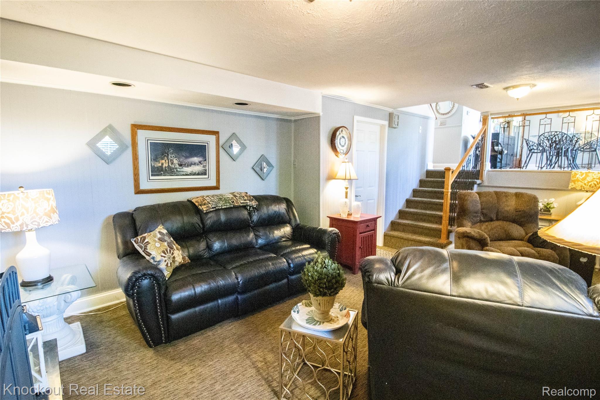 14720 Lincoln Road Chesaning, MI 48616 - Photo 36 of 60 Carpeted flooring, painted walls, ceiling lighting, and a staircase with wood railing