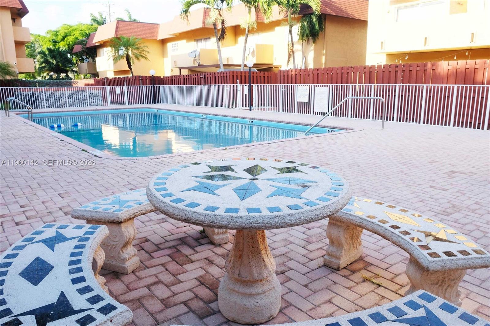 9970 Southwest 88th Street, Unit 9149 Miami, FL 33176 - Photo 28 of 32 Poolside seating areas