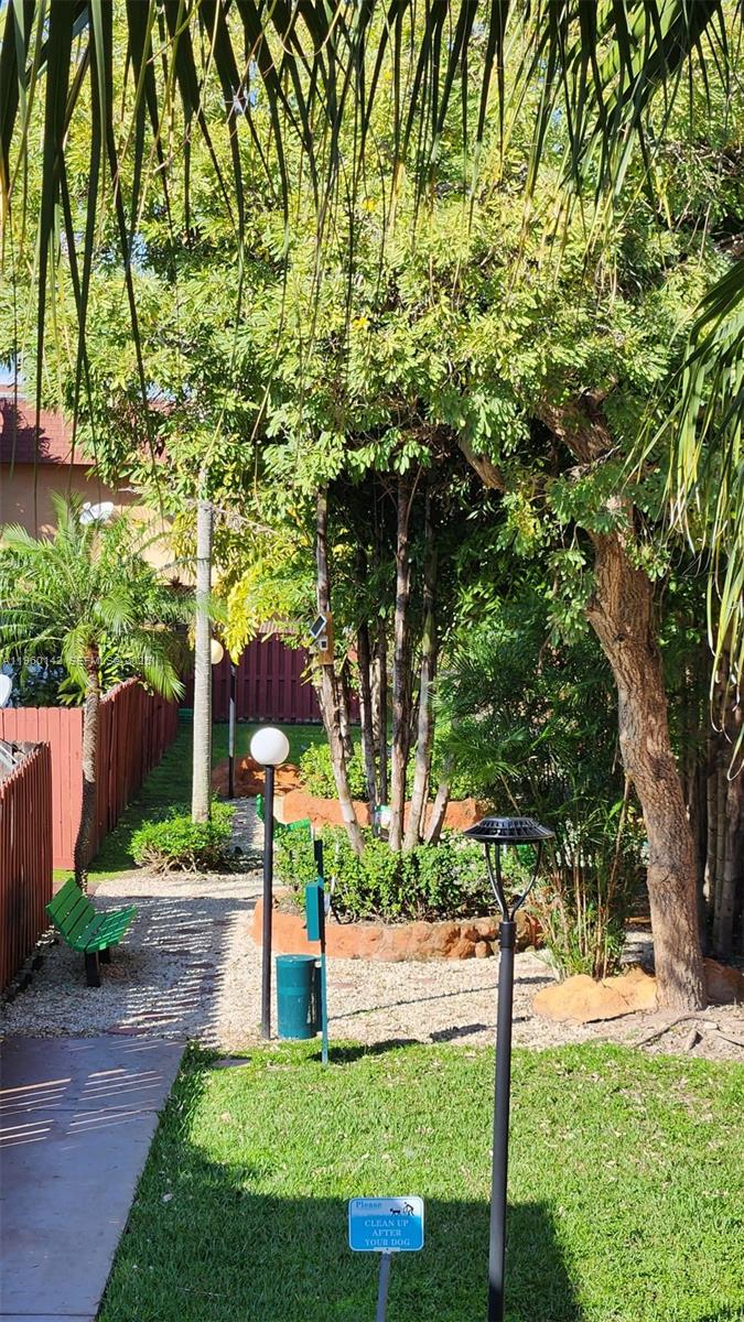 9970 Southwest 88th Street, Unit 9149 Miami, FL 33176 - Photo 30 of 32 Scenic garden path for peaceful walks