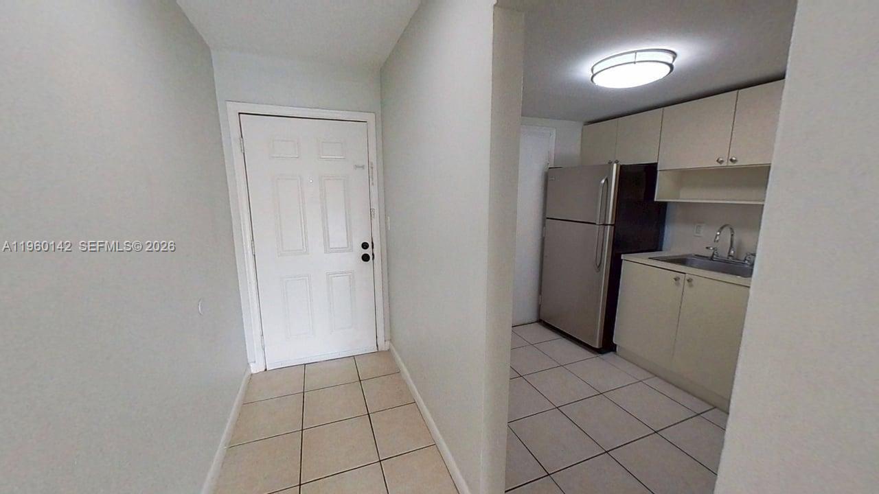 9970 Southwest 88th Street, Unit 9149 Miami, FL 33176 - Photo 8 of 32 Front Door and Kitchen