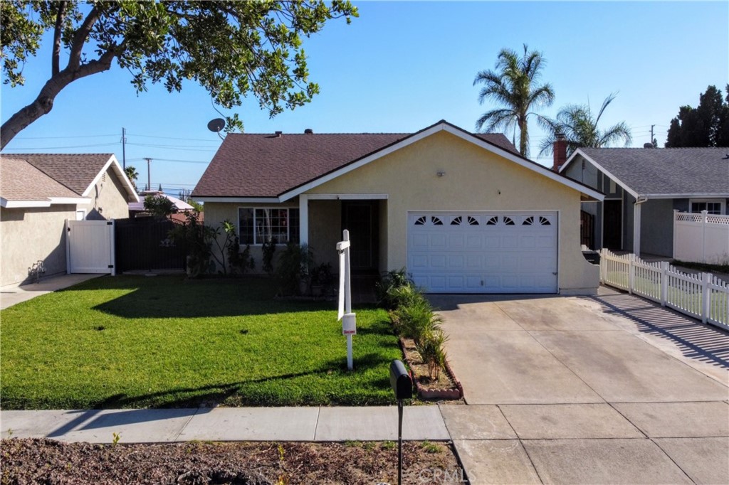 8429 Main Street Rancho Cucamonga, CA 91730 - Photo 1 of 1 a front view of a house with a garden and yard