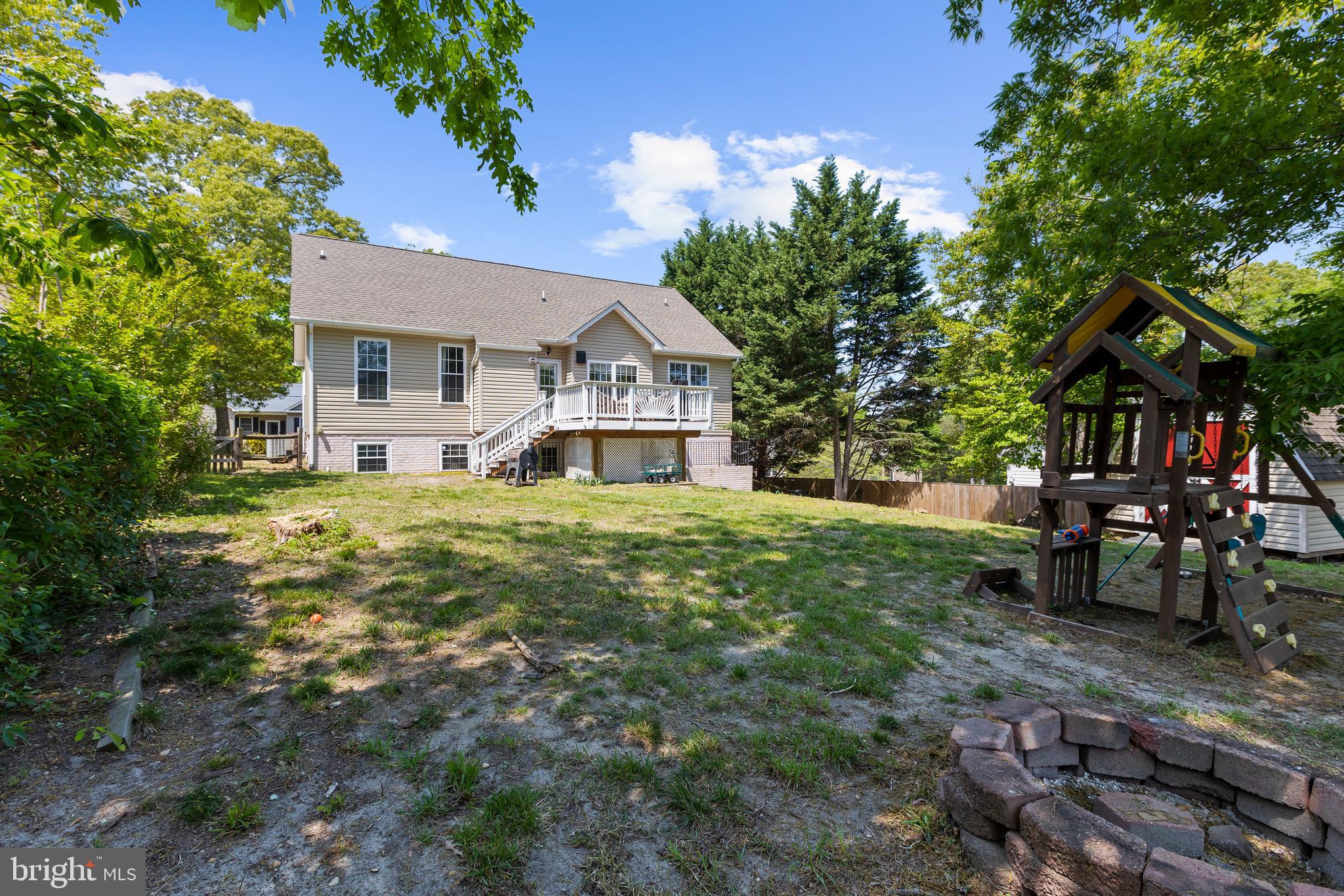11312 Rawhide Road Lusby, MD 20657 - Photo 9 of 57 a view of a house with a yard