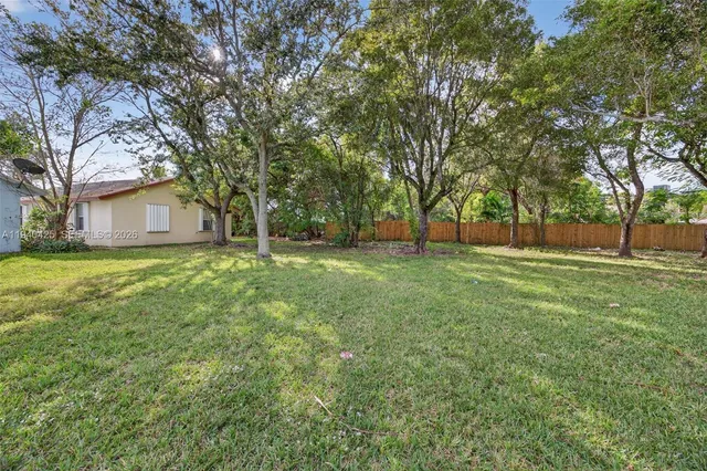 a house with trees in the background