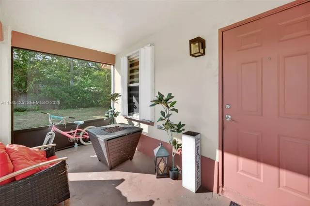 a living room with furniture and a window
