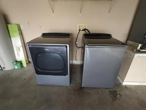 a utility room with dryer and washer