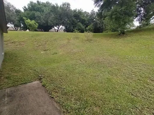 a view of a lake with a yard