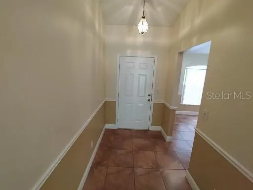 a view of a hallway with a bathroom