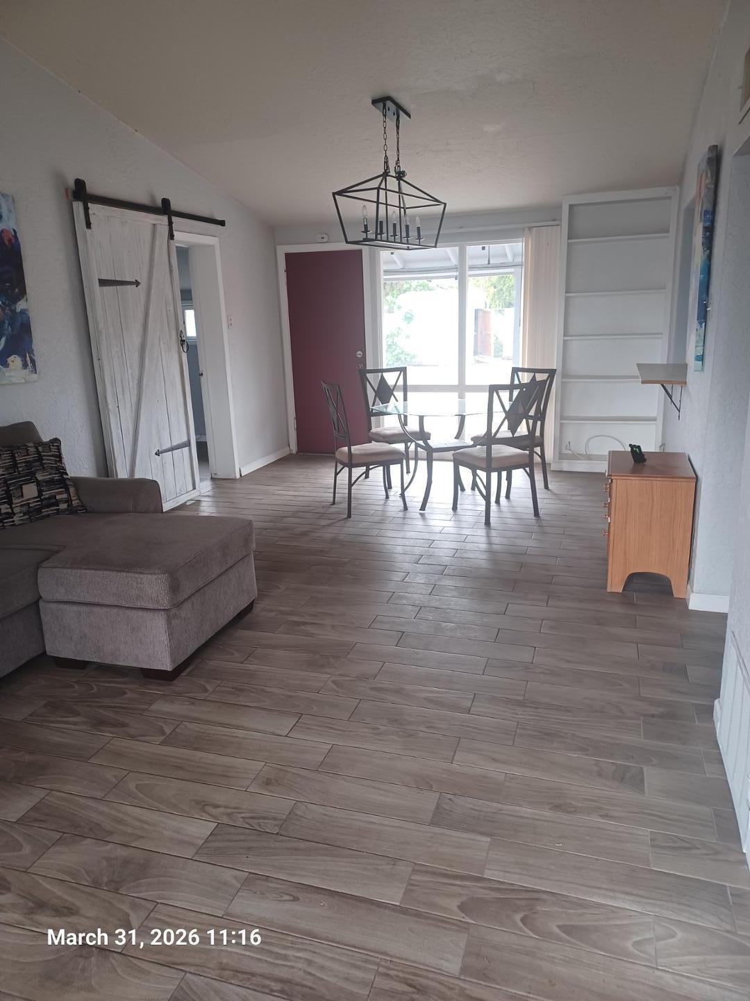 6746 North 14th Street Phoenix, AZ 85014 - Photo 2 of 9 a living room with furniture and a wooden floor