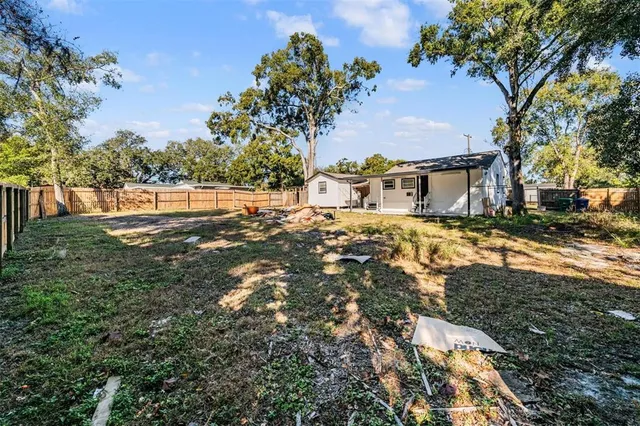 a backyard of a house with lots of green space