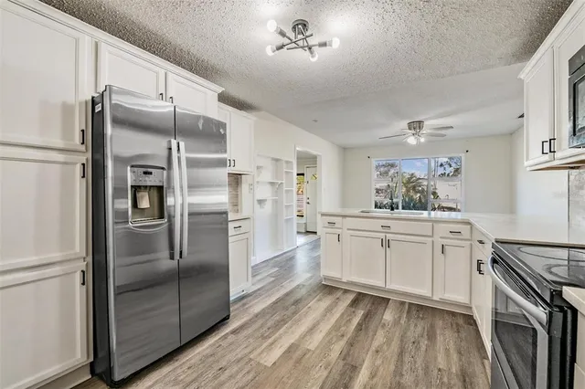 a kitchen with a refrigerator a sink and dishwasher