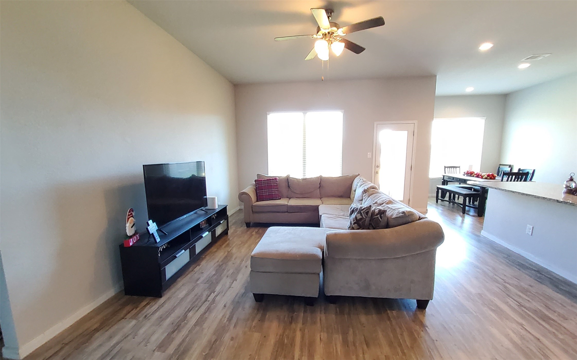 24418 Hollow Gate Meadow Court Spring, TX 77389 - Photo 13 of 45 a living room with furniture and a flat screen tv