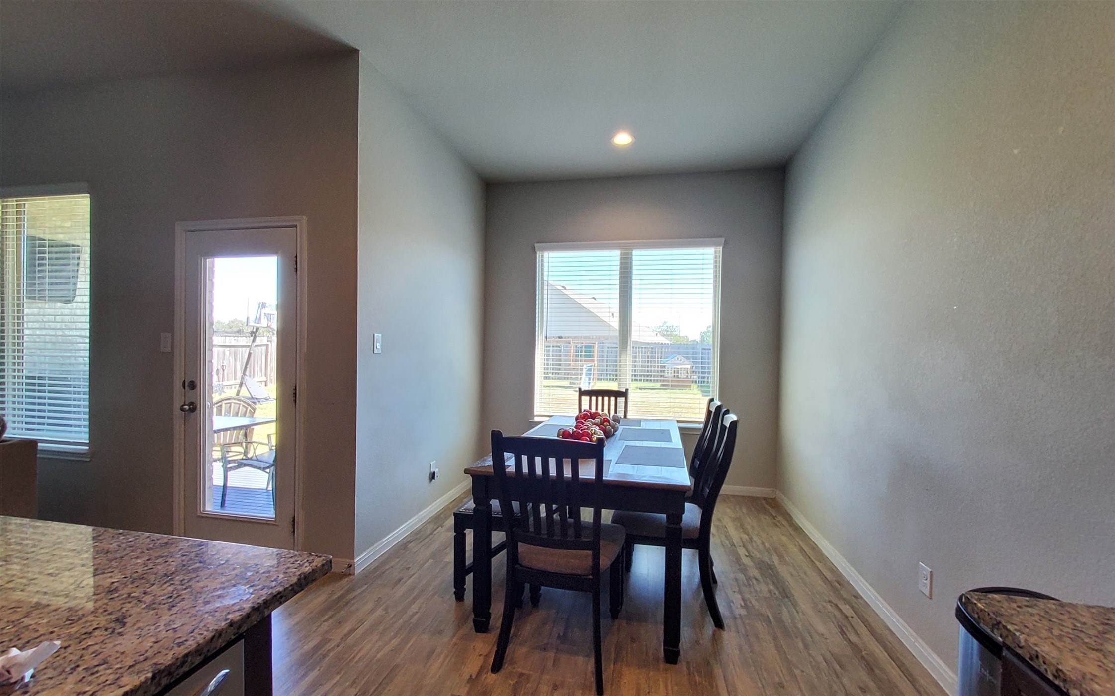 24418 Hollow Gate Meadow Court Spring, TX 77389 - Photo 22 of 45 a view of a dining room with furniture and wooden floor